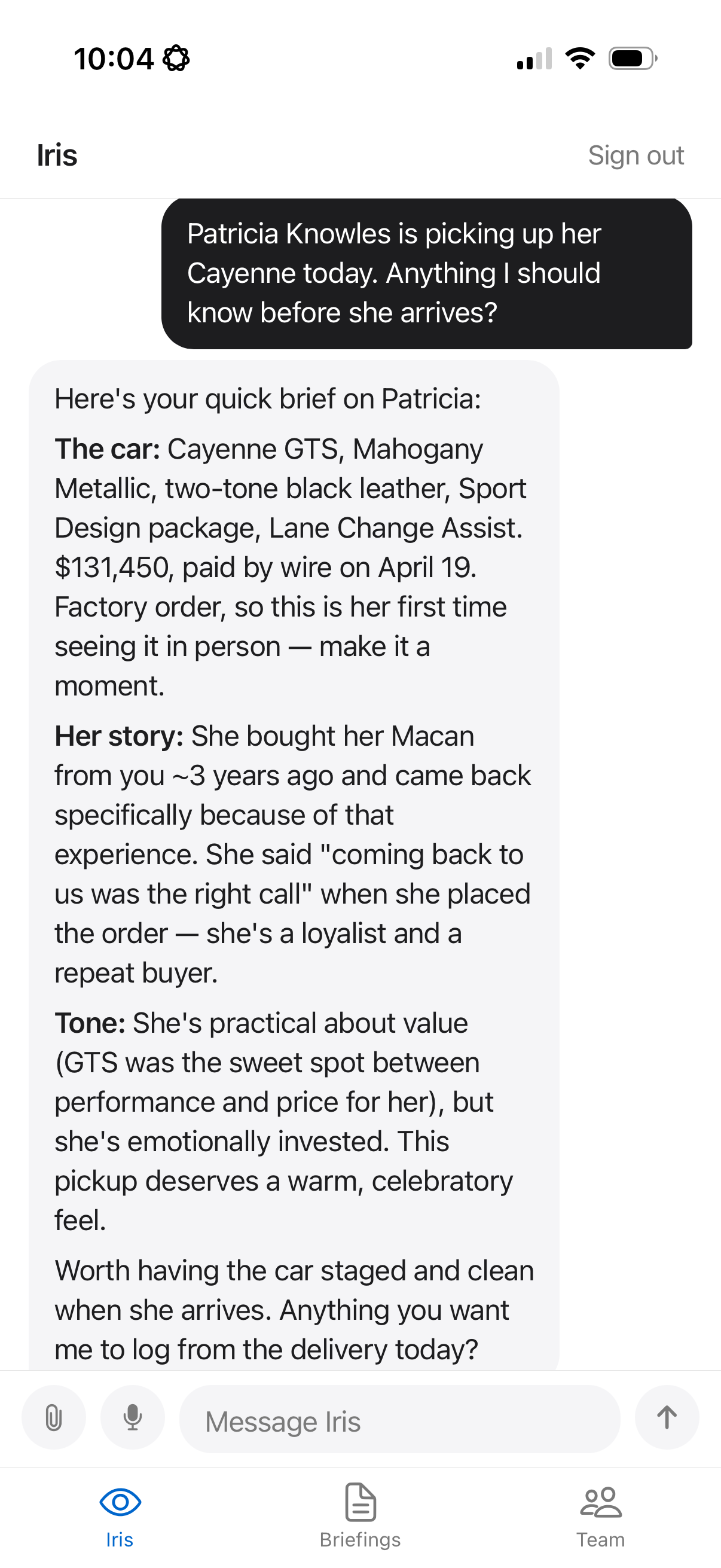 Iris briefing an automotive associate before a client factory order pickup