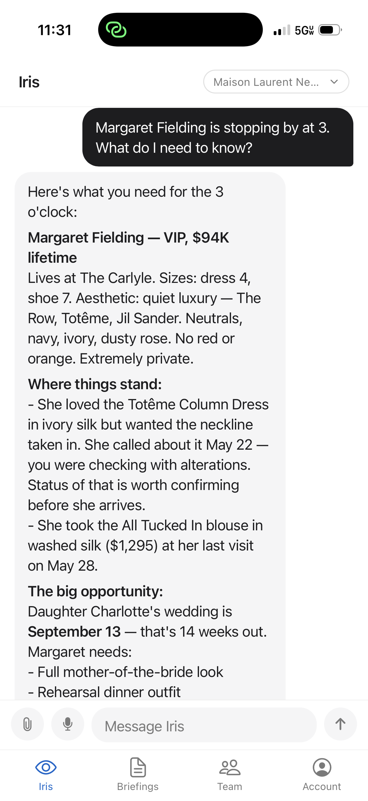 Iris briefing a fashion associate before a client walk-in